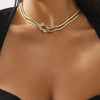 Thin gold necklace with small pendants